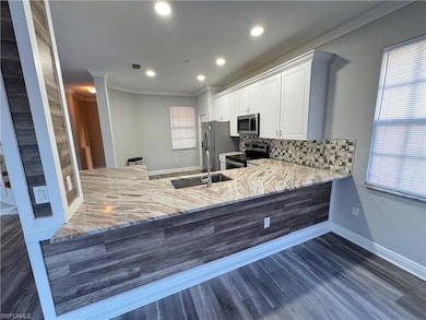 Kitchen with appliances with stainless steel finis