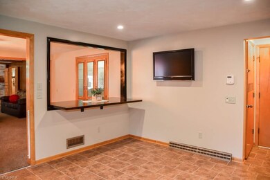 Breakfast bar with a serving window to the dining 