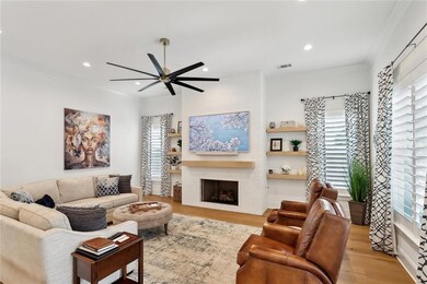 Living area, wood floors, crown molding, 11' ceili