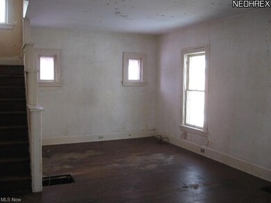 Large living room with plenty of natural light.