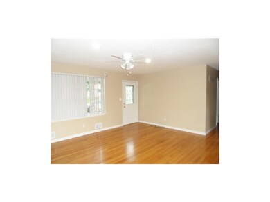 Hardwood floors in living room are in great shape.