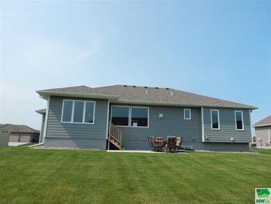 Rear view of house and yard