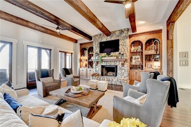 Great room featuring hardwood floors, beamed ceili