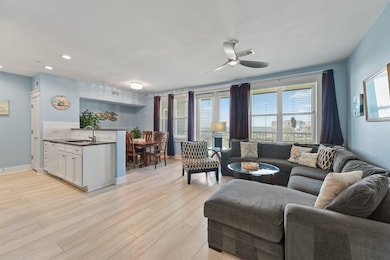 An open-concept design connects the kitchen, dining, and living areas, making it easy to entertain family and friends.