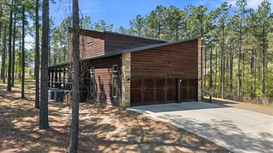 View of home's exterior with driveway, central AC,