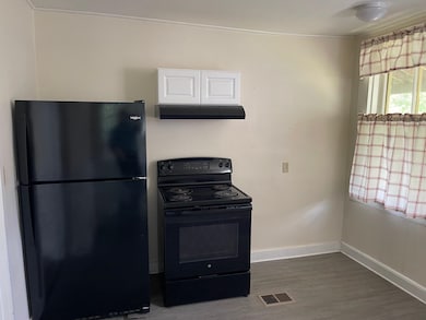 Kitchen w/ Stove & Fridge