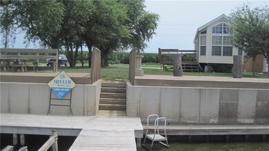 Cement seawall, 2 docks