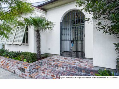 Enter through these custom wrought iron gates.