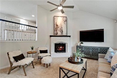 Living room with vaulted ceiling and updated light