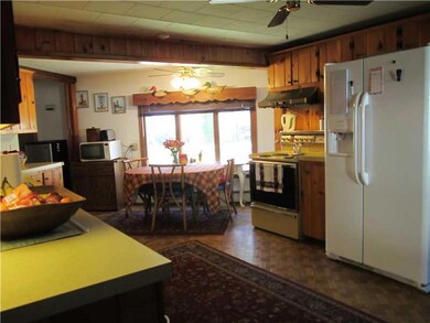 Kitchen. Enjoy a meal and a view of...