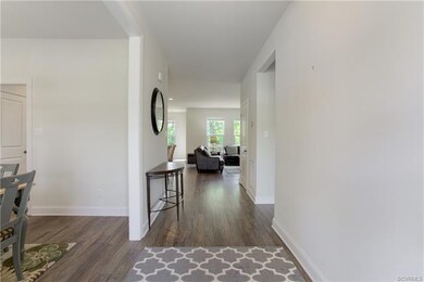 Foyer view with Dining room on left and 1st floor bedroom w/ full bath on right