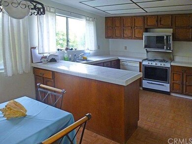 Alternate view of kitchen with eat-in dining