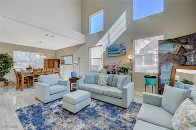 Living room with a chandelier, visible vents, a hi