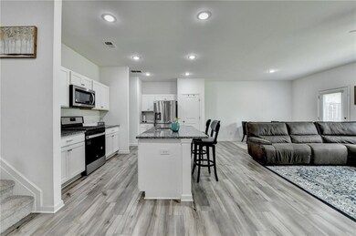 Kitchen with appliances with stainless steel finis
