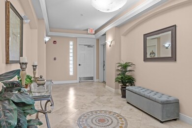 Entryway featuring baseboards and crown molding