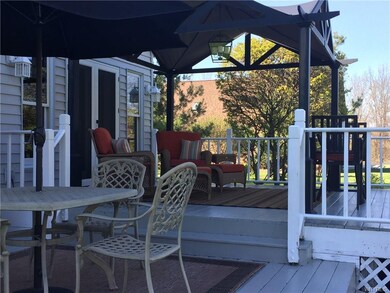 Awning on back, private deck.  Covered porch on fr