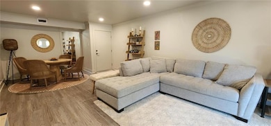 Dining room with baseboards and wood finished floo