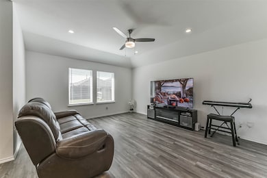 Large family room overlooks the backyard.