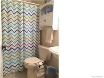 Guest/Hall bathroom has pedestal sink.