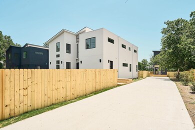 View of side of property featuring stucco siding 