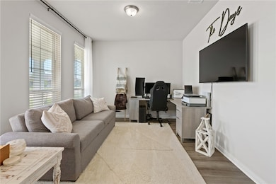 Office area featuring wood finished floors and bas