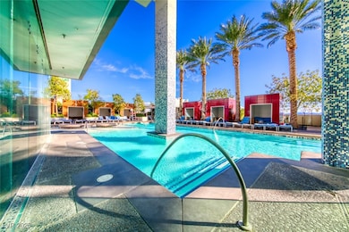 Community pool with a patio