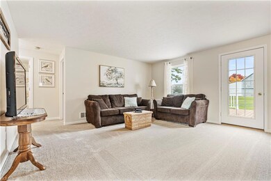 Family room featuring light colored carpet