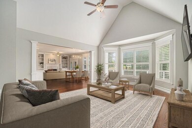 The Vaulted Living Room is spacious and inviting, perfect for a large TV and comfortable seating.