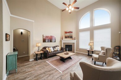 The family room (16x22) has ceiling to ground custom windows, wood-look tile floors, 2