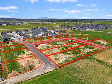 Aerial perspective of suburban area featuring property parcel outlined and a mountainous background