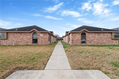 View of property exterior with a lawn