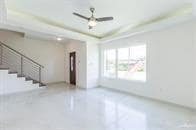 Empty room featuring ceiling fan