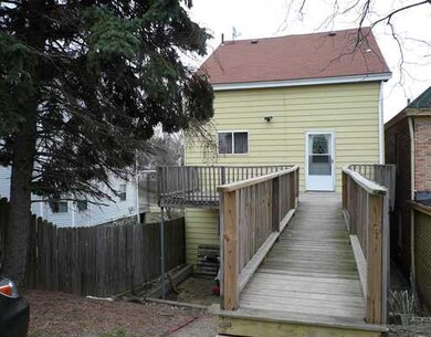 Exterior Back. Large rear deck with walkway from 4