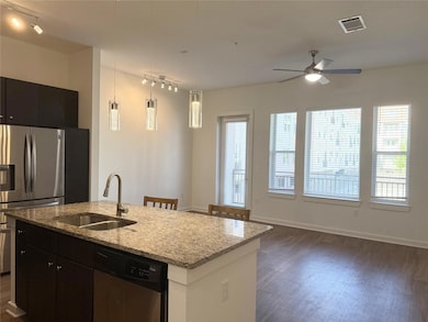 Kitchen featuring stainless steel appliances, dar