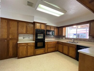 Large kitchen with newer appliances and lots of be