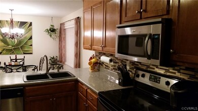 Kitchen with SS and full tile backsplash
