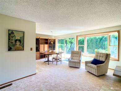 Living room is large and encompasses the dining room