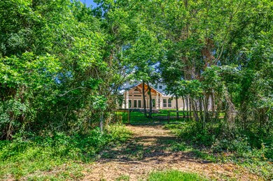 Back of Main Home thru the Trees