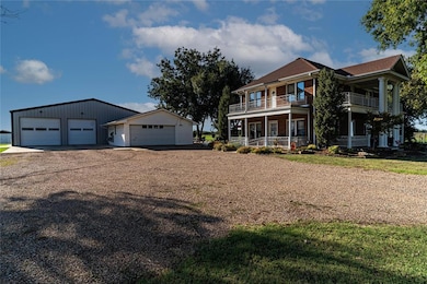 View of front of home featuring an outbuilding, a 