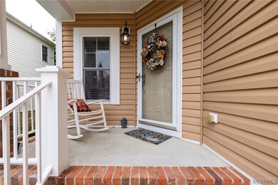 View of exterior entry with a porch
