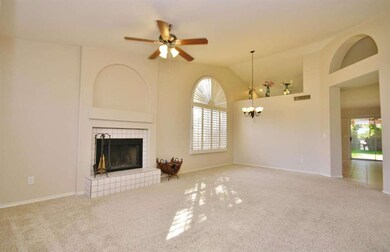 Living Room w/ Fireplace / Dining Room