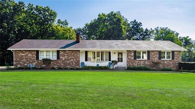 Ranch-style home with a front yard
