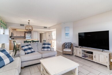 Living room featuring an inviting chandelier