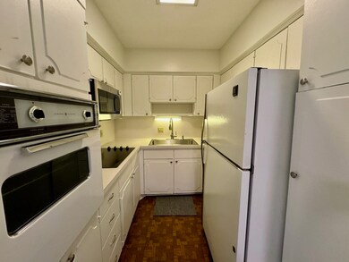 Kitchen with new cooktop, microwave and dishwasher