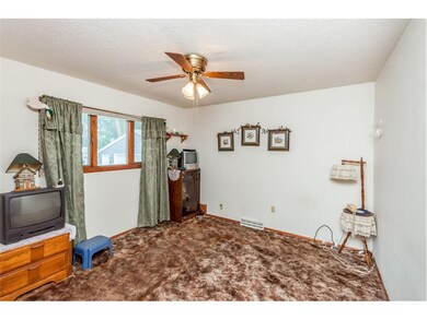 2nd bedroom on main floor with large windows.