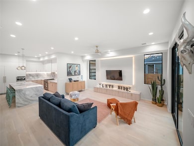 Living room featuring recessed lighting, light wood-type flooring, and ceiling fan