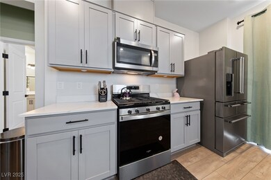 Kitchen featuring light countertops, stainless ste