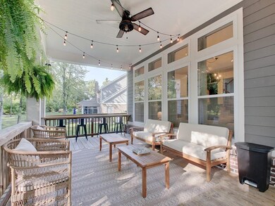 Covered patio with a multitude of seating off of great room
