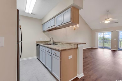 Kitchen with ceiling fan, hardwood / wood-style fl