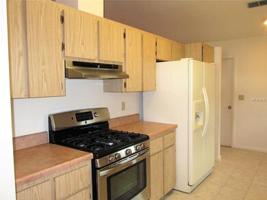 kitchen with newer gas stove - cathedral ceilings